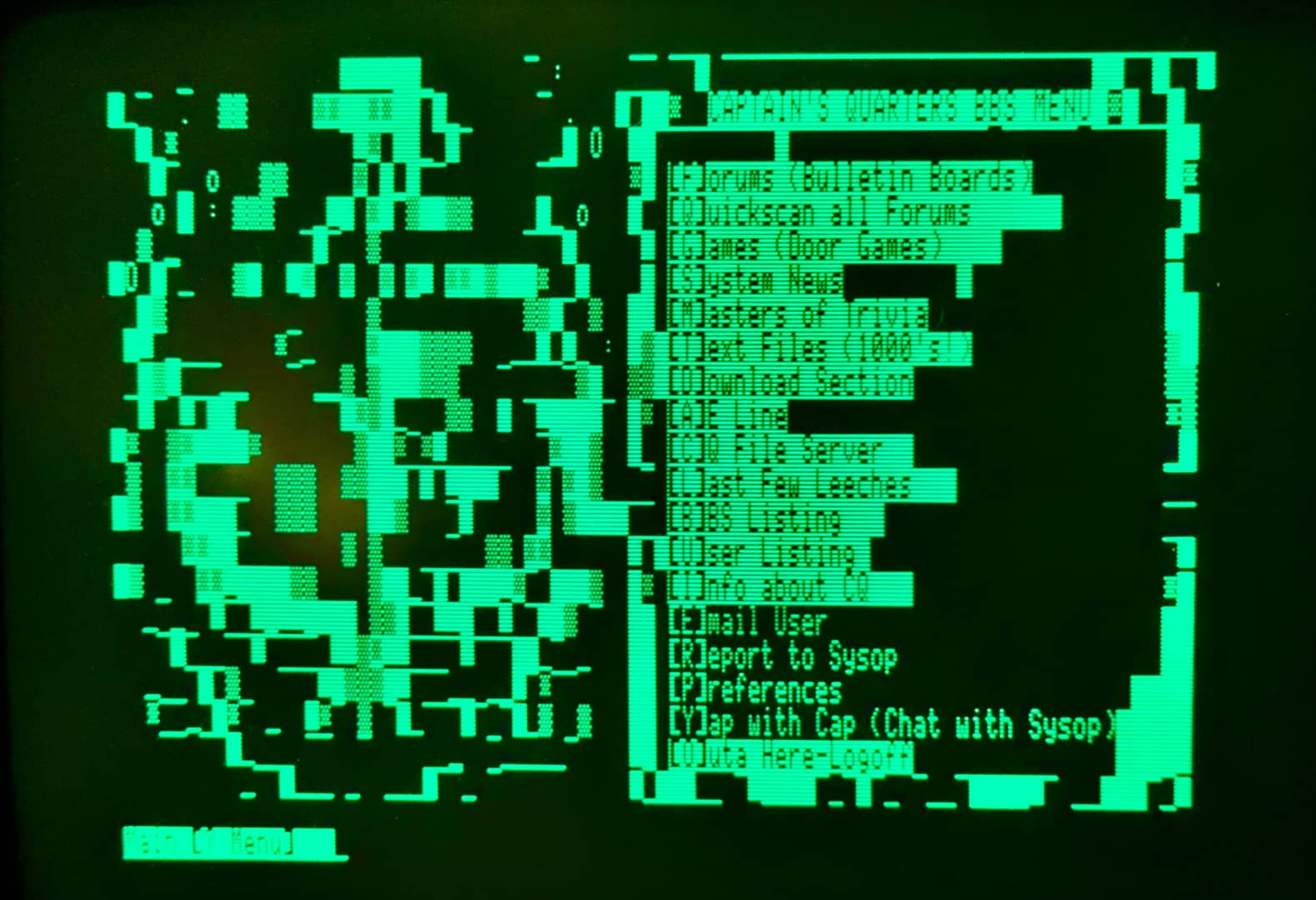 The Captain’s Quarters BBS menu, displayed in monochrome green on a CRT monitor. On the left is a poorly-rendered example of ANSI art, and on the right is the menu. The options are: forums, quickscan all forums, games (door games), system news, masters of trivia, text files, download sections, AE line, CQ file server, last few leeches, BBS listing, user listing, info about CQ, email user, report to sysop, preferences, yap with cap, and outa here - logoff