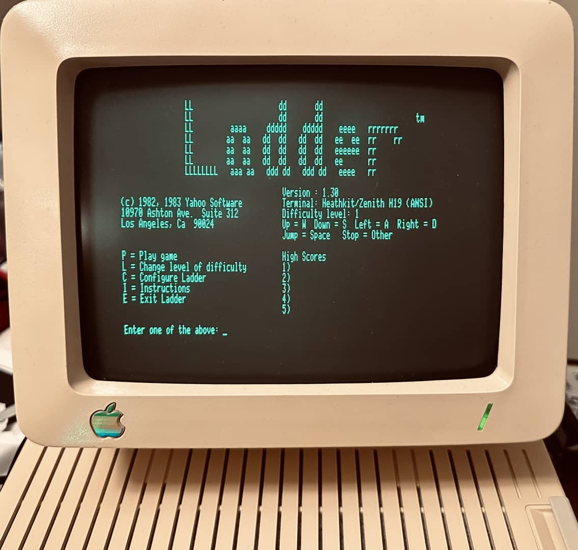 The startup menu for Ladder, a platformer for CP/M computers, on an Apple IIc monitor